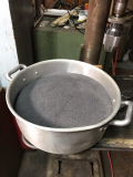 A very fine screen will filter the hematite from Silica sand